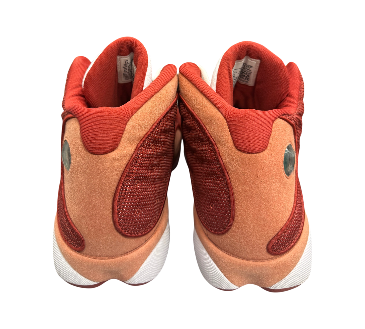 Genesis Boutique Jordan 13 Dune Red sneakers showing the rear view with red suede and mesh detailing