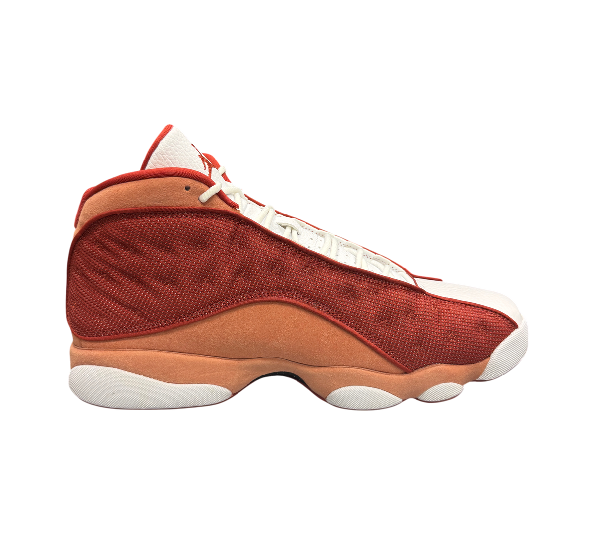 Genesis Boutique Jordan 13 Dune Red sneakers in white and red suede, side profile view on a shoebox.