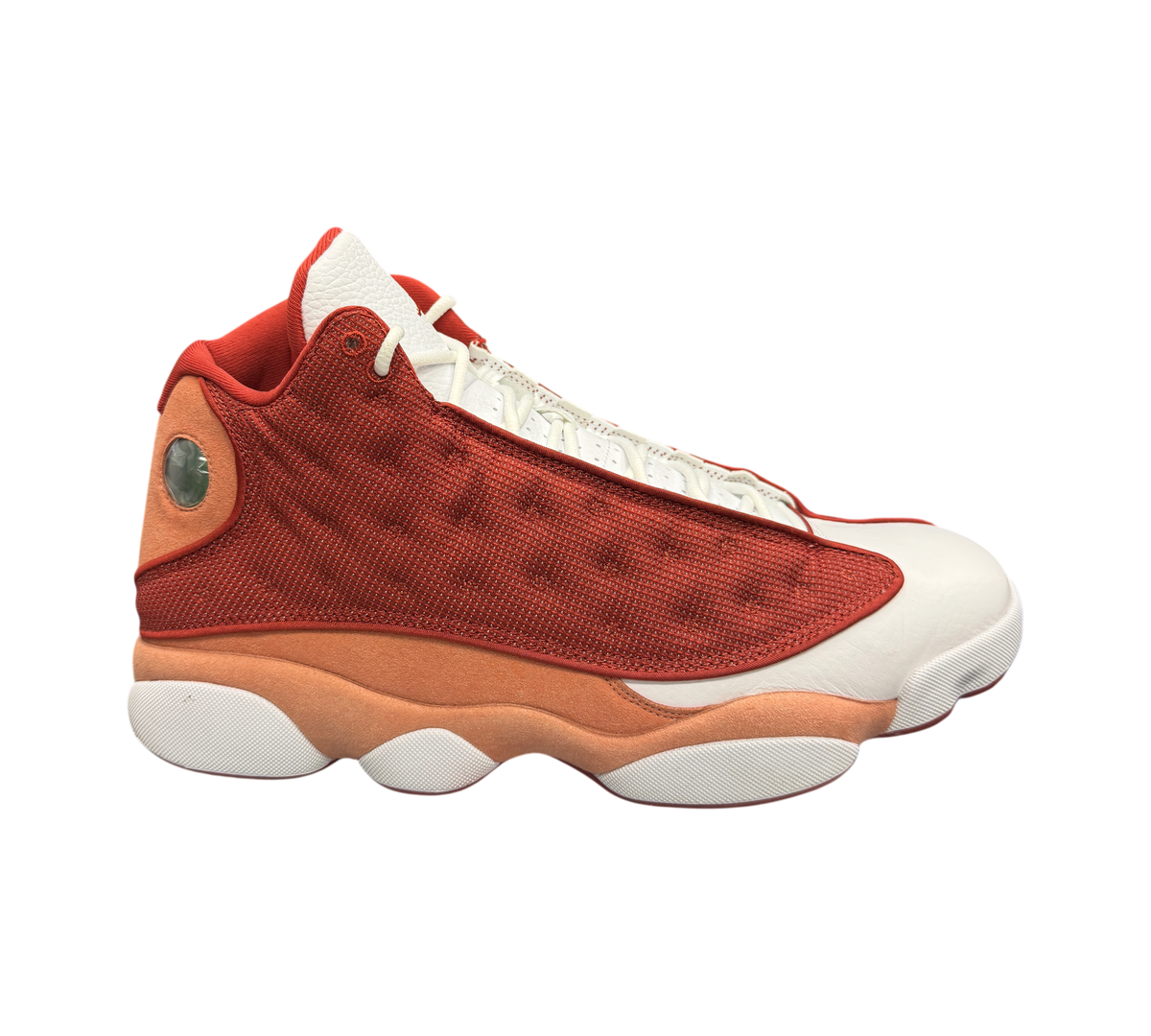 Genesis Boutique Jordan 13 Dune Red sneakers featuring a red and white leather and mesh upper with a holographic logo