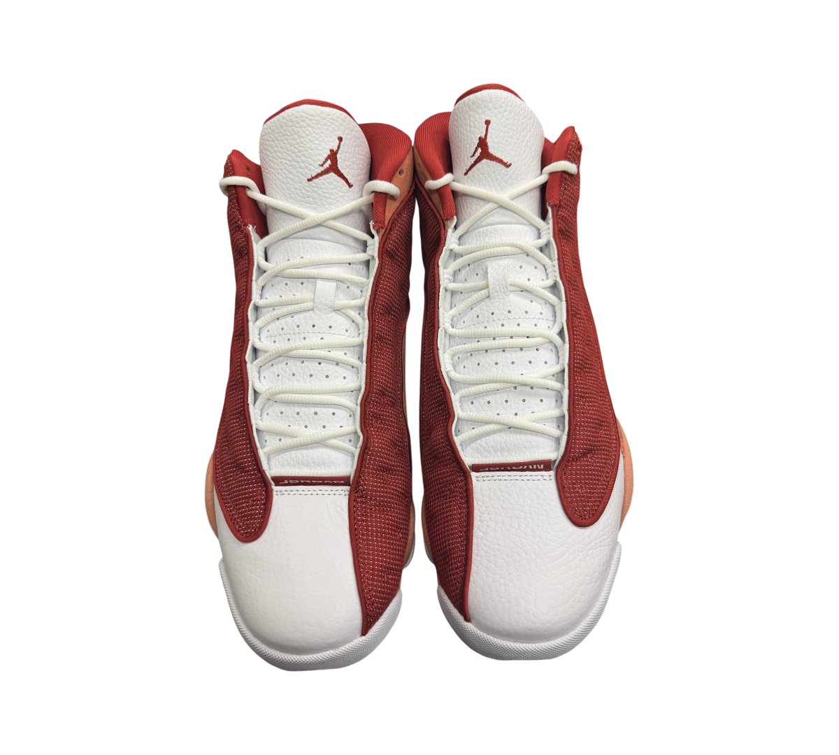 Genesis Boutique Jordan 13 Dune Red sneakers in white and red leather with mesh overlays and Jumpman logo detailing.