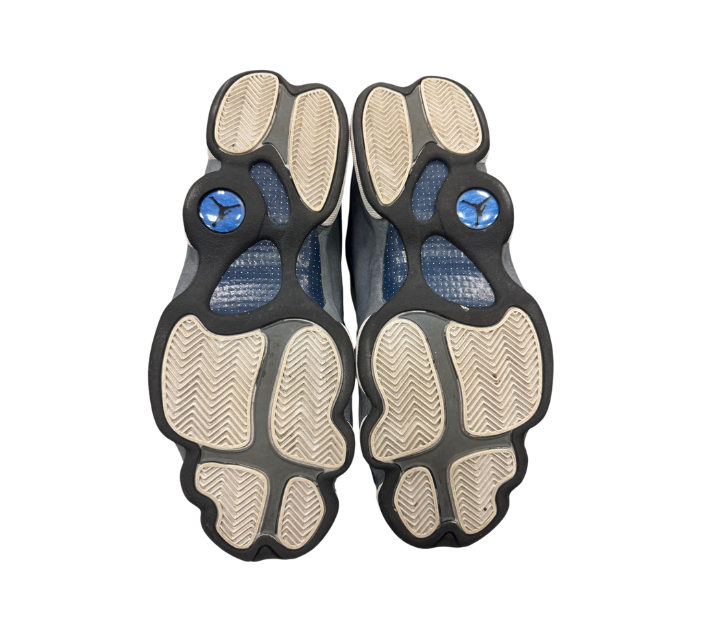Genesis Boutique used Jordan 13 Flint sneakers showing the grey and white herringbone traction outsoles
