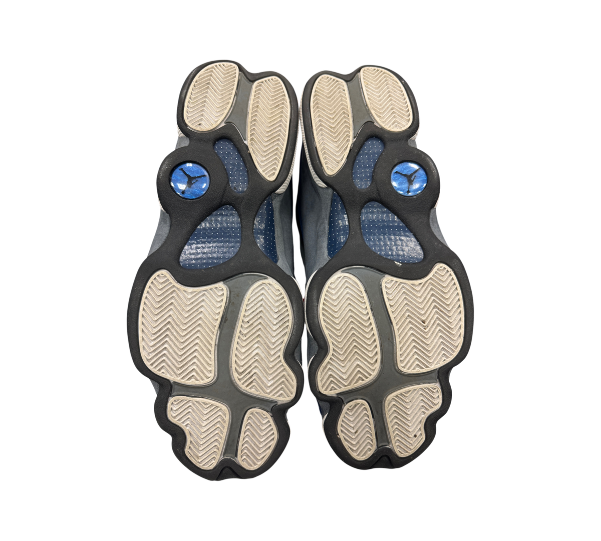 Genesis Boutique used Jordan 13 Flint sneakers showing the grey and white herringbone traction outsoles