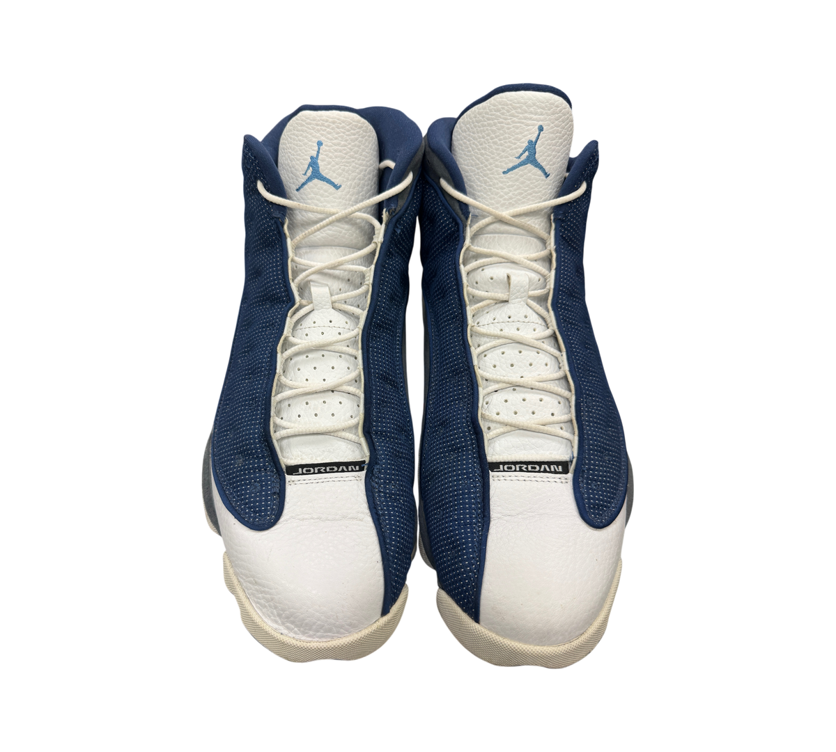 Genesis Boutique Jordan 13 Flint sneakers in navy blue and white leather with a light blue Jumpman logo on the tongue.