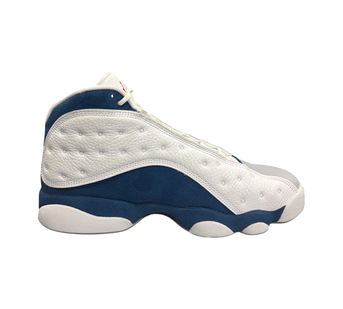 Genesis Boutique Jordan 13 French Blue sneakers in white leather and blue suede side profile view