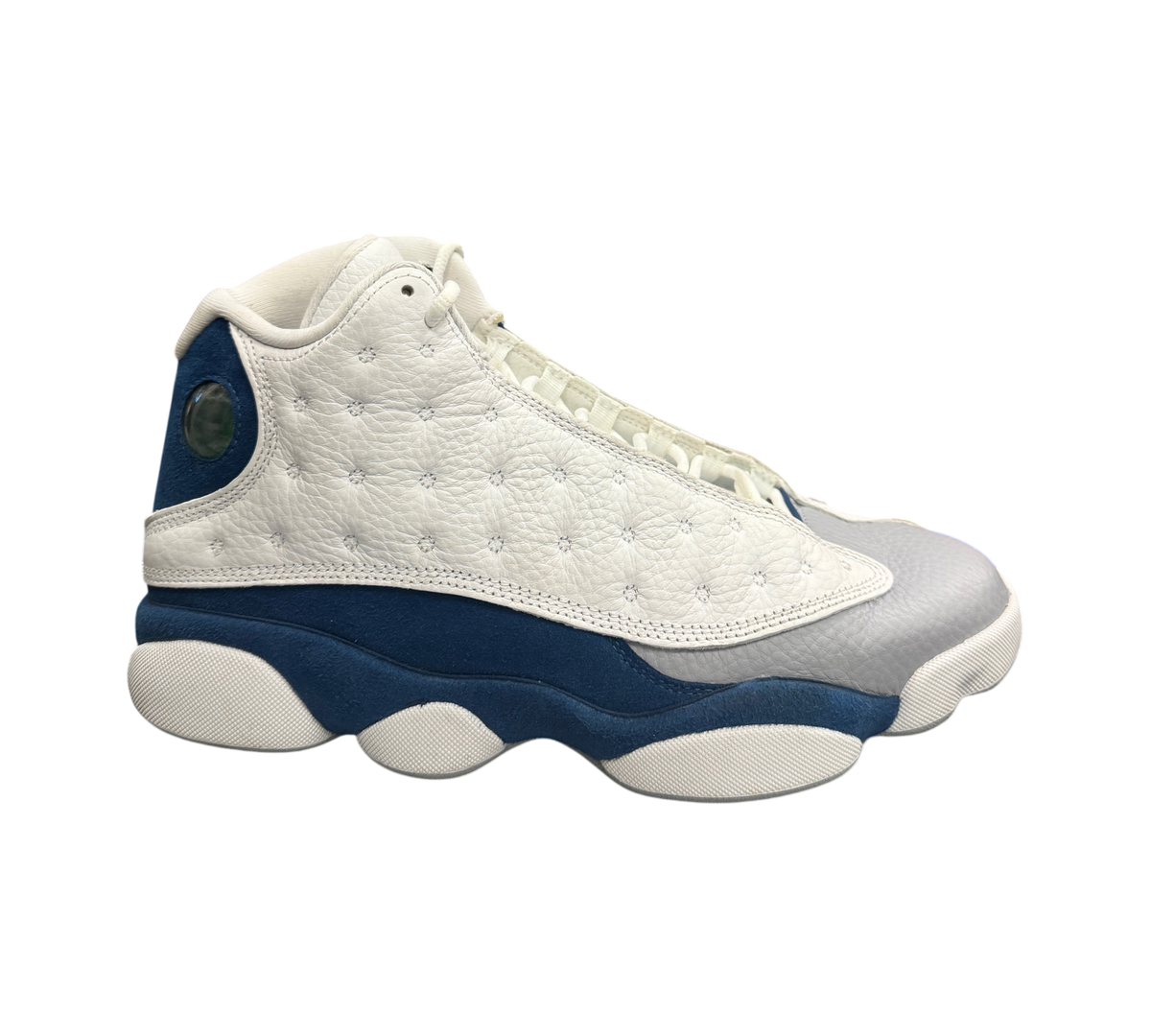 Genesis Boutique Jordan 13 French Blue sneakers featuring white tumbled leather and blue suede overlays