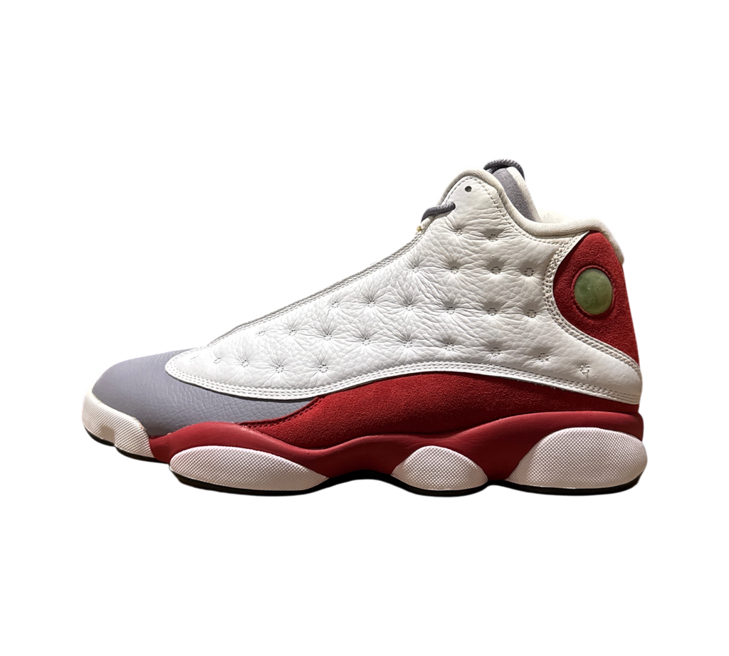 Genesis Boutique Jordan 13 Grey Toe sneakers featuring white tumbled leather, grey toe cap, and red suede accents.