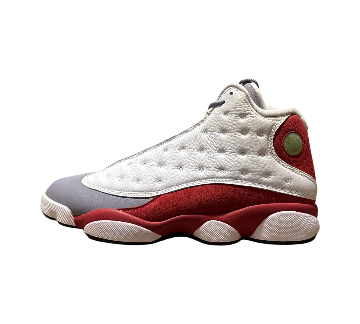 Genesis Boutique Jordan 13 Grey Toe sneakers featuring white tumbled leather, grey toe cap, and red suede accents.