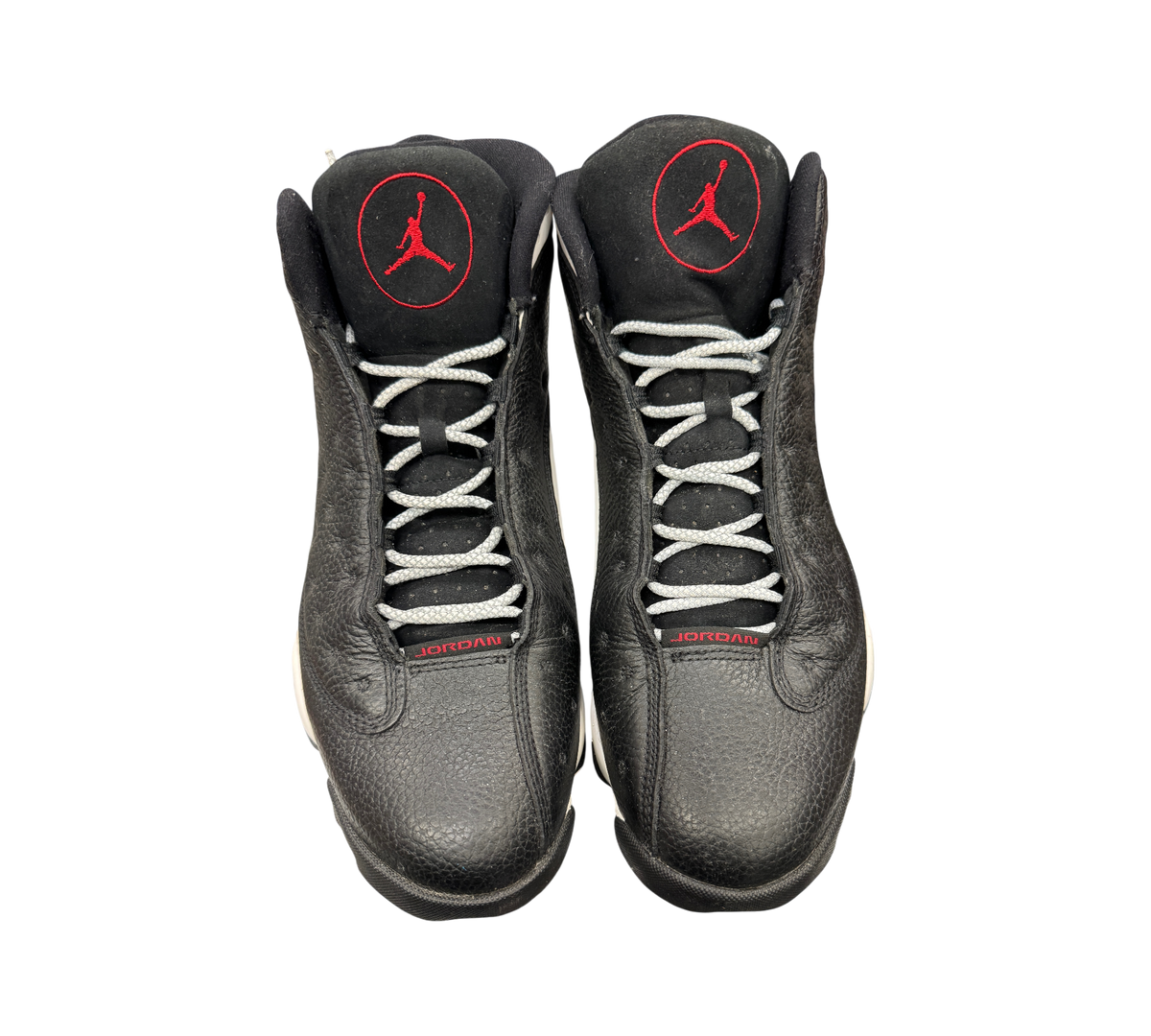 Genesis Boutique Jordan 13 Reverse He Got Game sneakers in black leather with red Jumpman logos and grey laces.