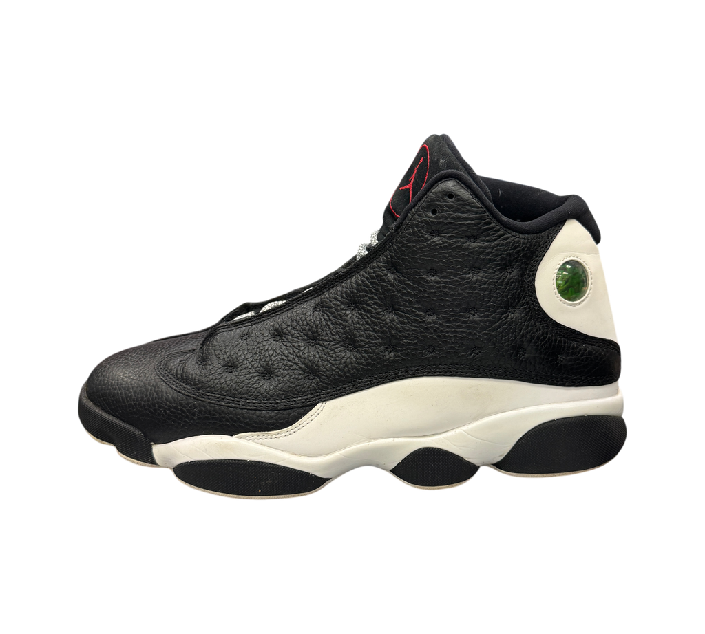 Genesis Boutique Jordan 13 Reverse He Got Game sneakers in black and white leather with signature holographic heel logo