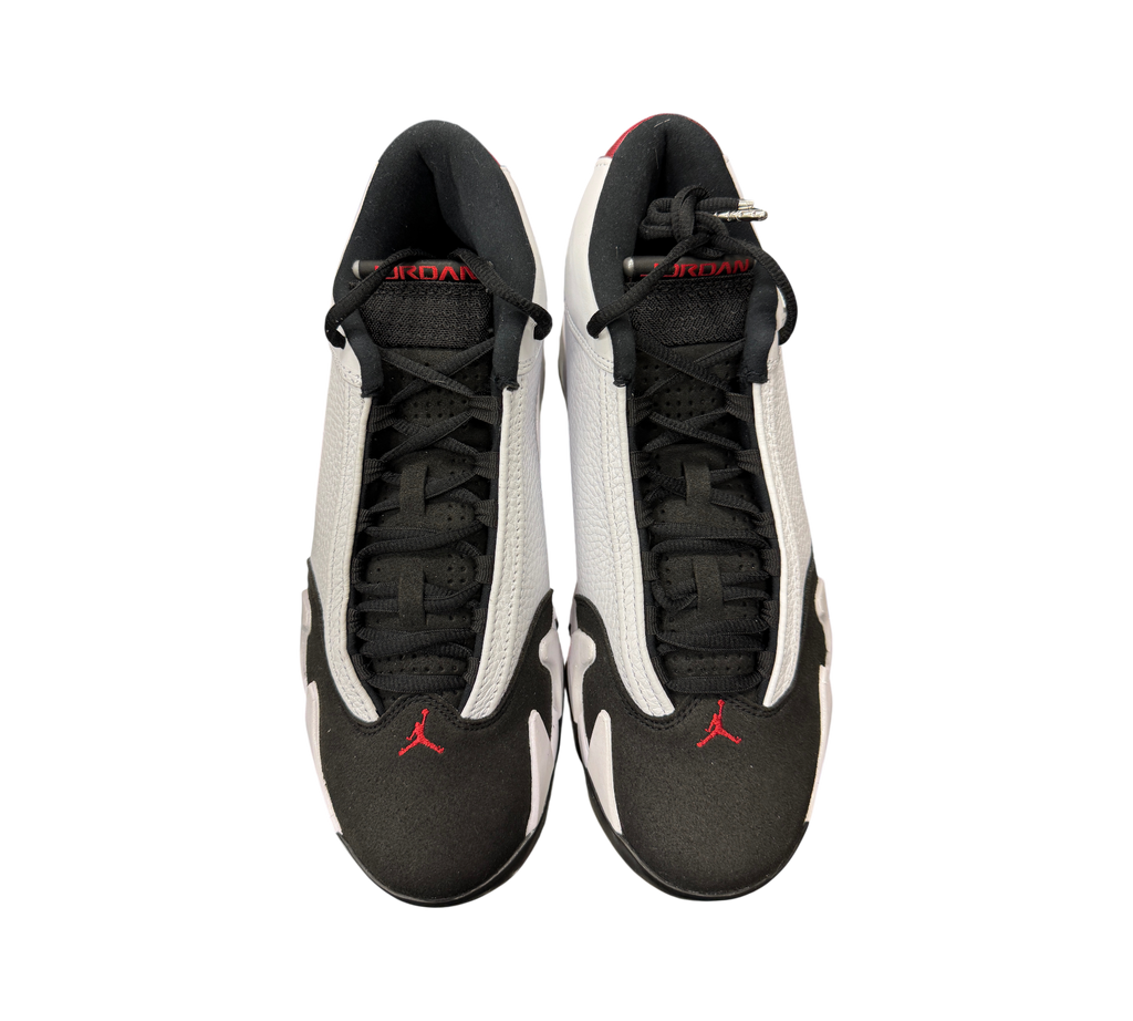 Genesis Boutique Jordan 14 Black Toe sneakers featuring white leather, black suede toe caps, and red Jumpman accents.