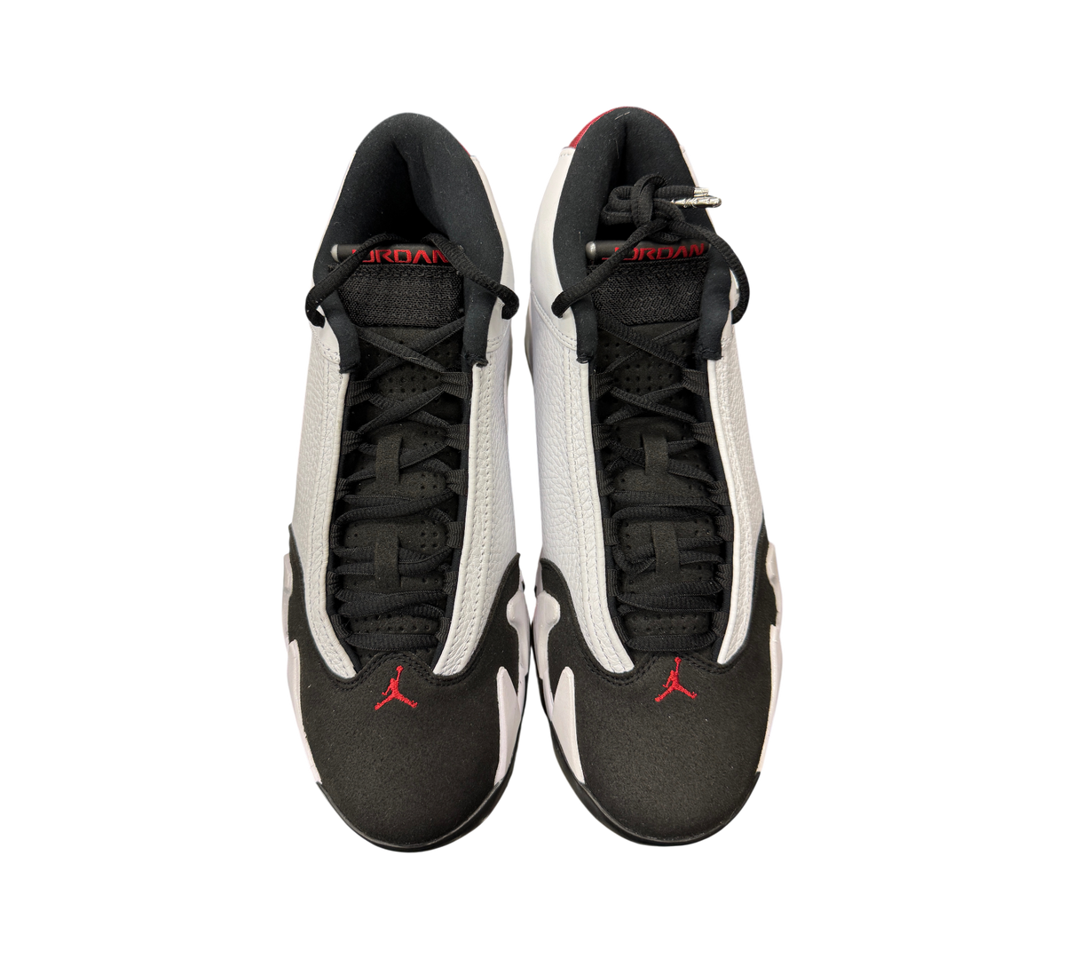 Genesis Boutique Jordan 14 Black Toe sneakers featuring white leather, black suede toe caps, and red Jumpman accents.