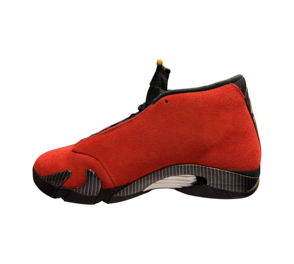 Genesis Boutique Jordan 14 Ferrari sneakers in red suede with carbon fiber detailing, displayed on a shoe box.