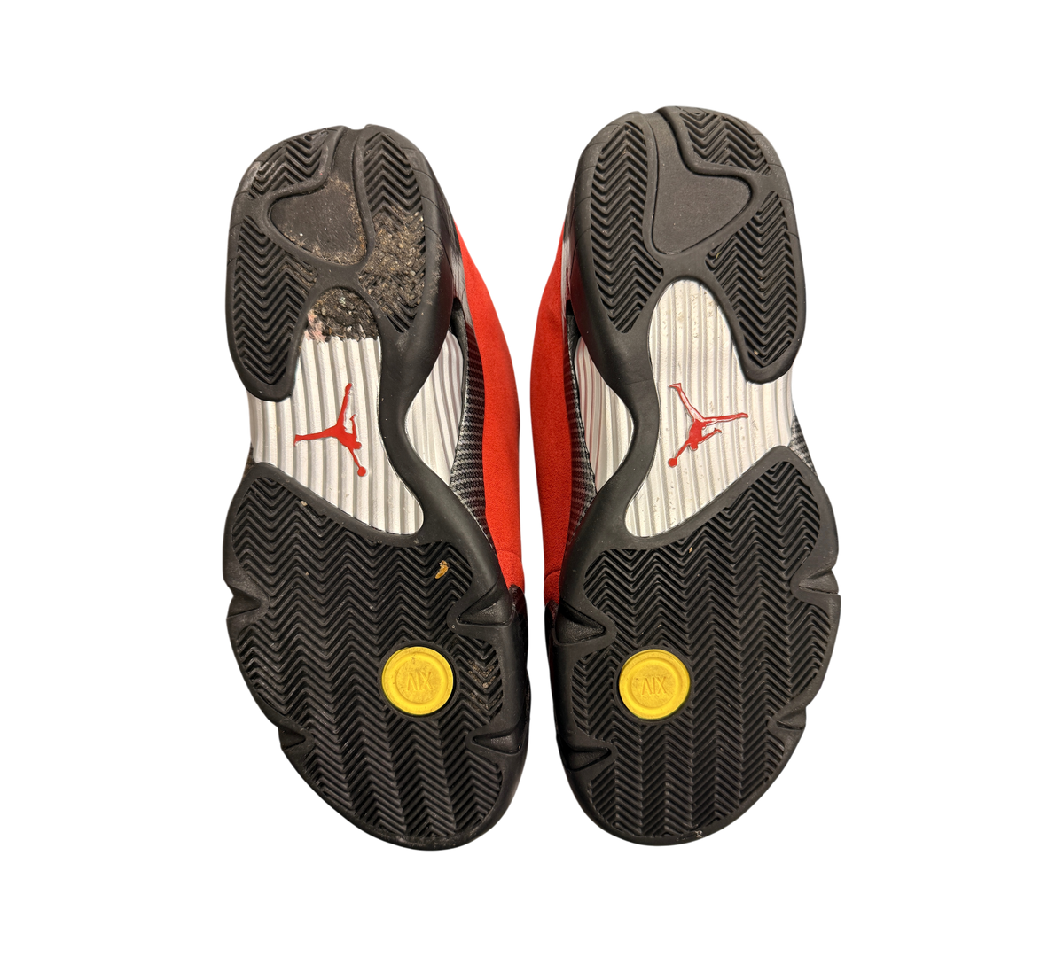Genesis Boutique used Jordan 14 Ferrari sneakers showing black rubber outsoles with red Jumpman logos and yellow accents