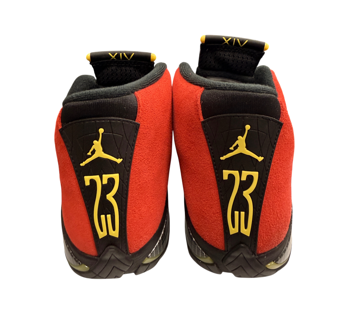 Genesis Boutique Jordan 14 Ferrari sneakers in red suede with yellow Jumpman and 23 branding on the heel.