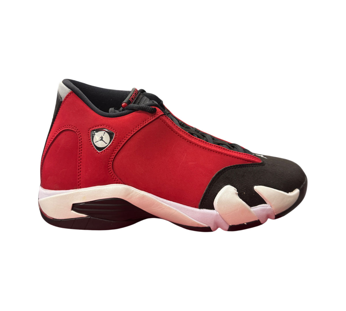 Genesis Boutique Jordan 14 Toro Bravo sneakers in red and black suede with white accents, side profile view.