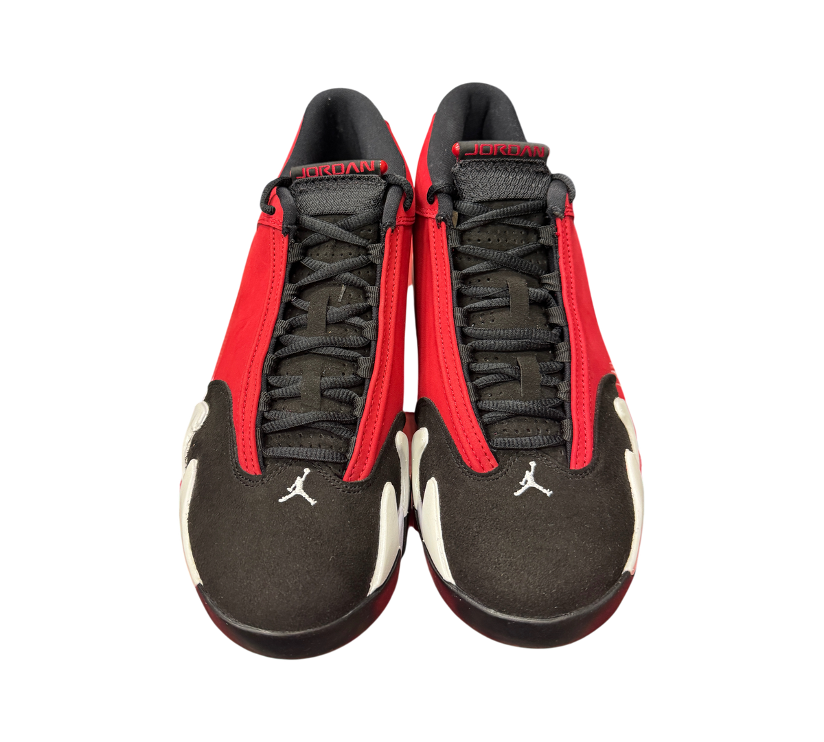 Genesis Boutique Jordan 14 Toro Bravo sneakers in red and black suede with white accents, front view.
