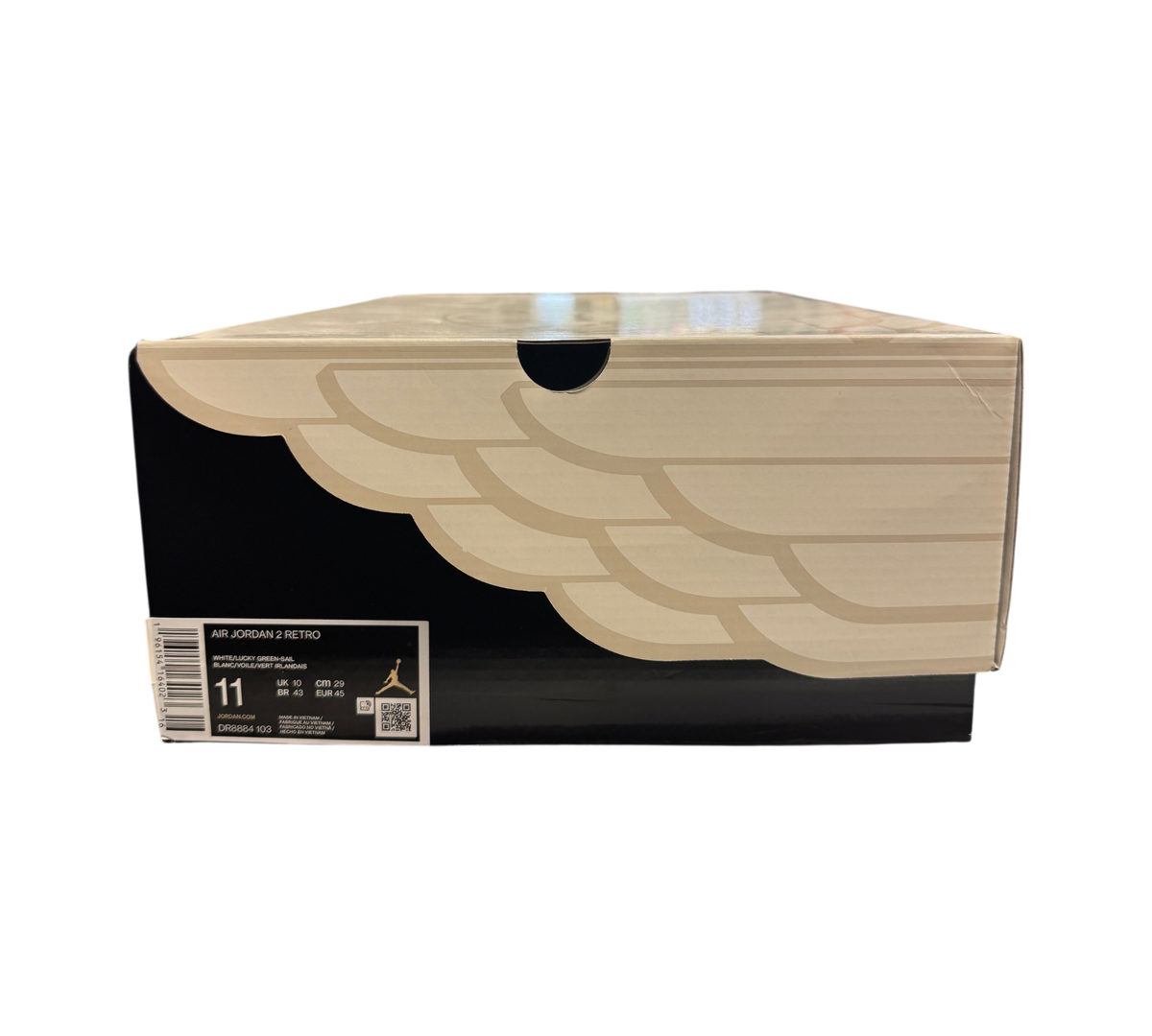 Genesis Boutique Jordan 2 Lucky Green sneaker box with white and black design on a store display counter