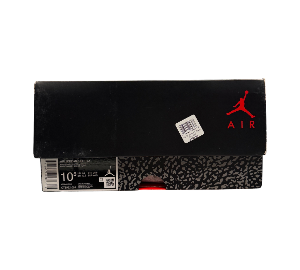Genesis Boutique Jordan 3 Black Cat sneaker box with red Jumpman logo and size 10.5 label on a glass display counter