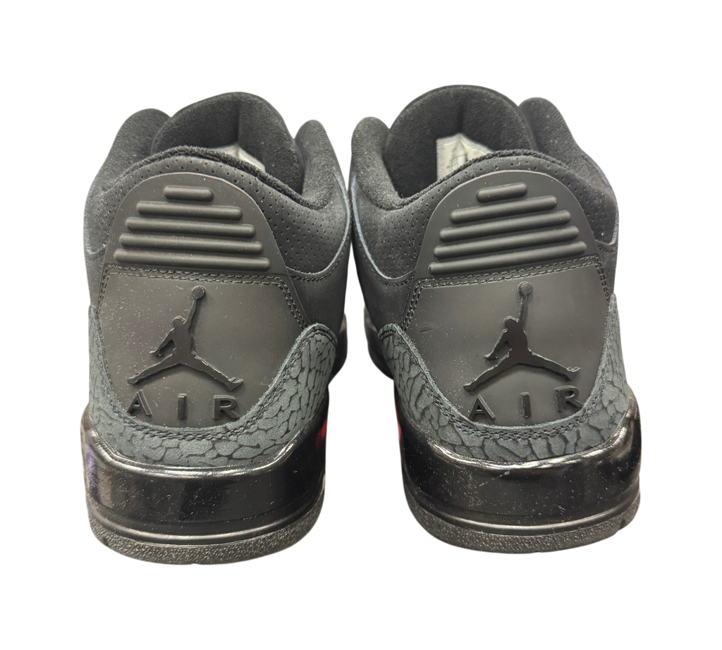 Genesis Boutique Jordan 3 Black Cat sneakers showing the black elephant print heel tabs and Jumpman Air branding.