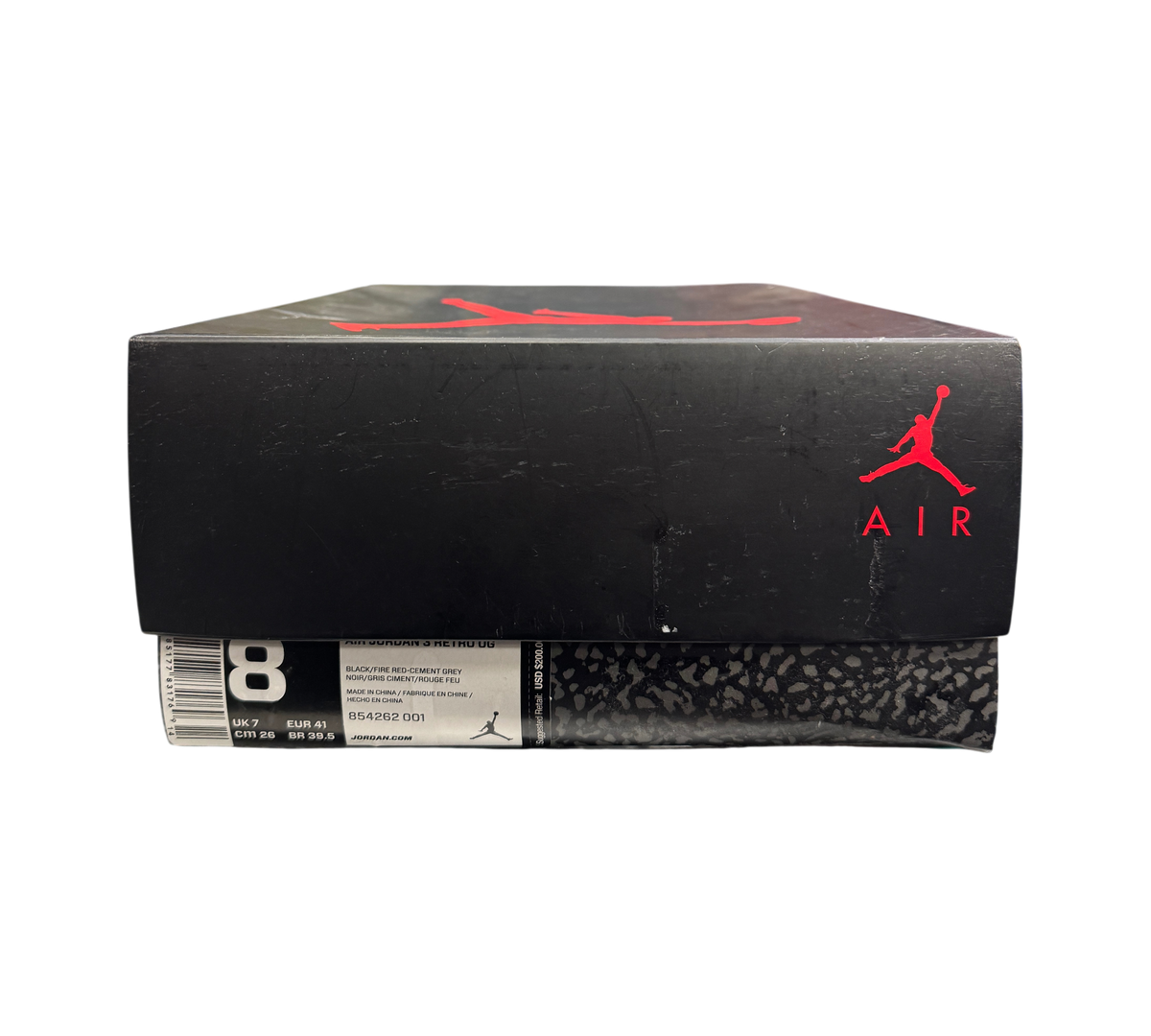 Genesis Boutique Jordan 3 2018 Black Cement sneaker box with red Jumpman logo on a store shelf