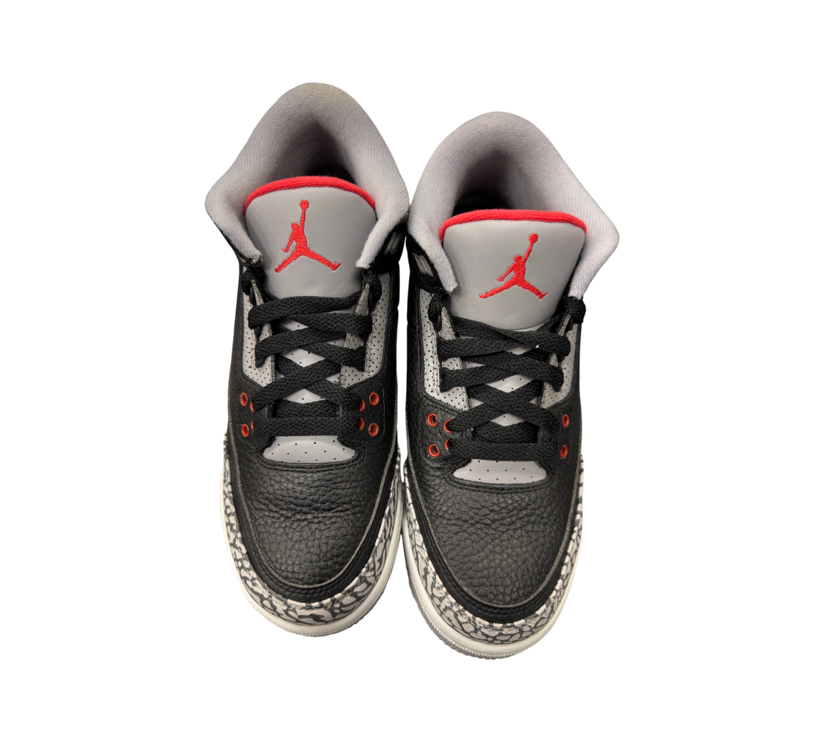 Genesis Boutique Jordan 3 Black Cement GS sneakers featuring black leather, grey tongues, and iconic elephant print.