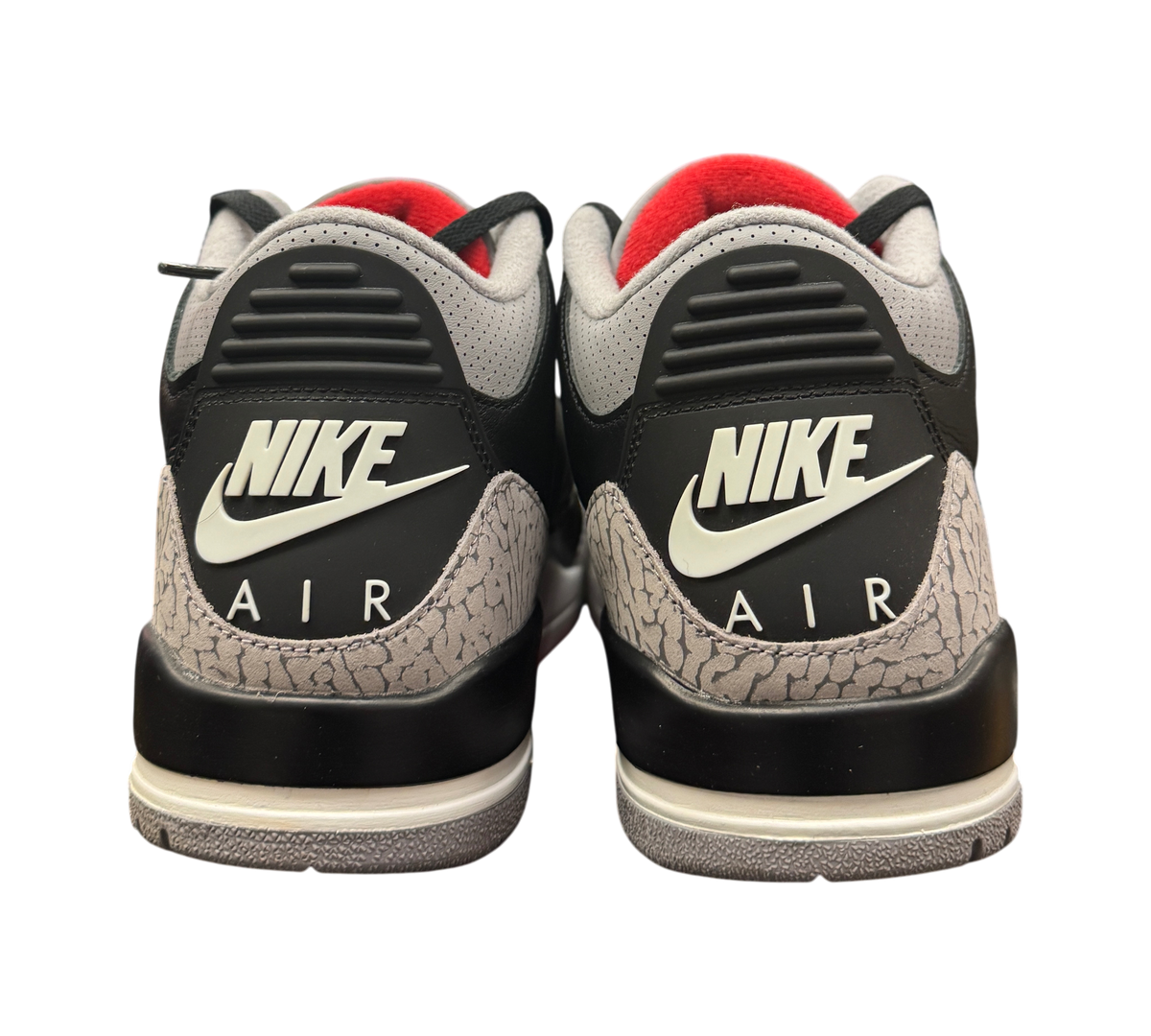 Genesis Boutique Jordan 3 Black Cement sneakers showing the iconic elephant print heel and Nike Air branding