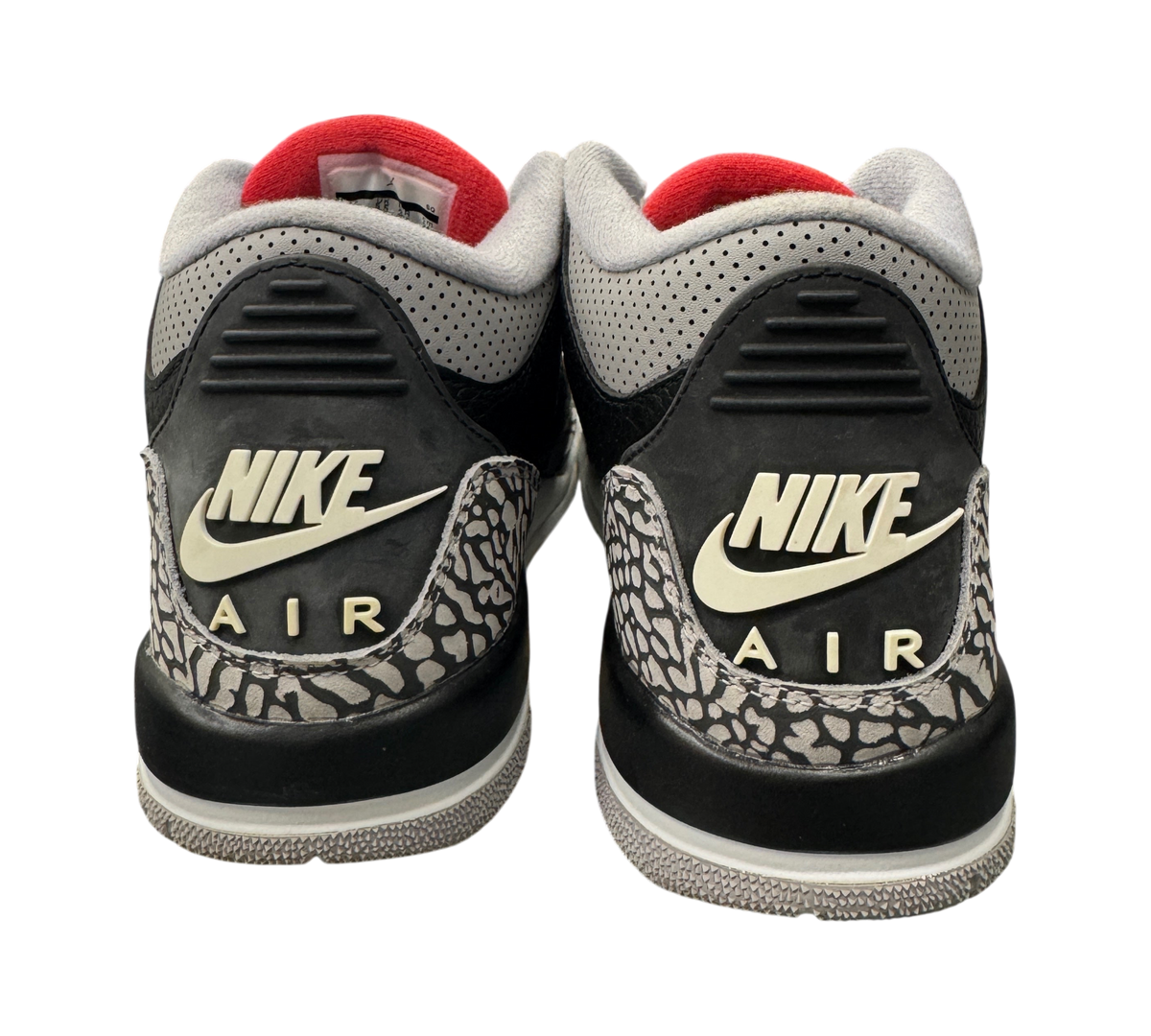 Genesis Boutique Jordan 3 Black Cement GS sneakers showing the iconic Nike Air heel branding and elephant print detail.