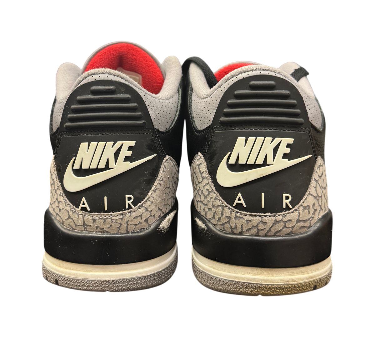 Genesis Boutique Jordan 3 Black Cement sneakers showing the iconic elephant print heel and Nike Air branding