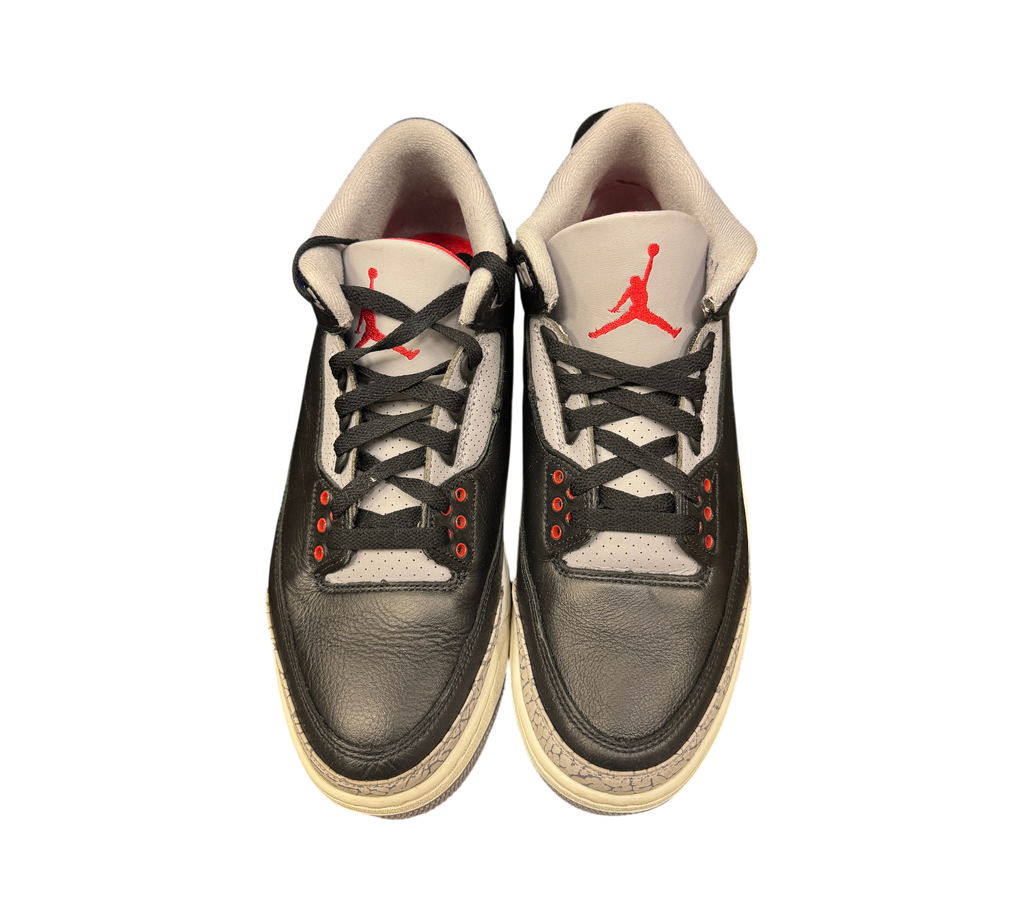 Genesis Boutique Jordan 3 Black Cement sneakers featuring black leather, grey elephant print, and red Jumpman logo.