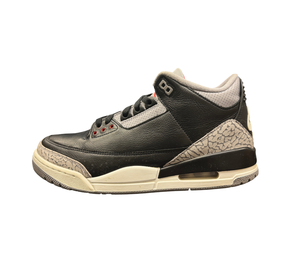 Genesis Boutique Jordan 3 Black Cement sneakers featuring black leather, grey elephant print, and red eyelet details.