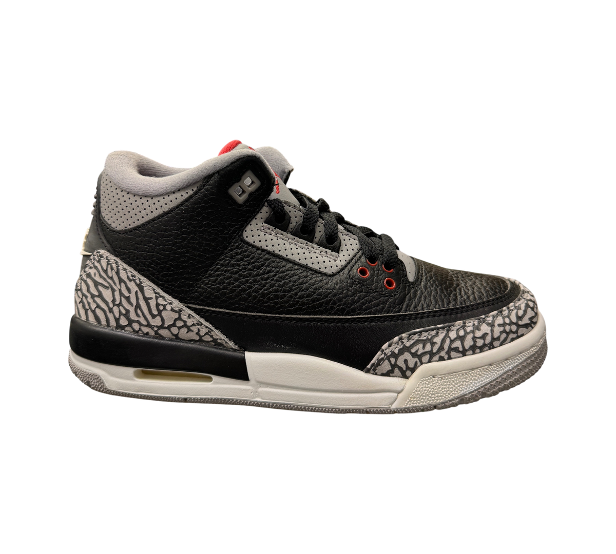 Genesis Boutique Jordan 3 Black Cement GS sneakers featuring black leather, grey elephant print, and red accents.