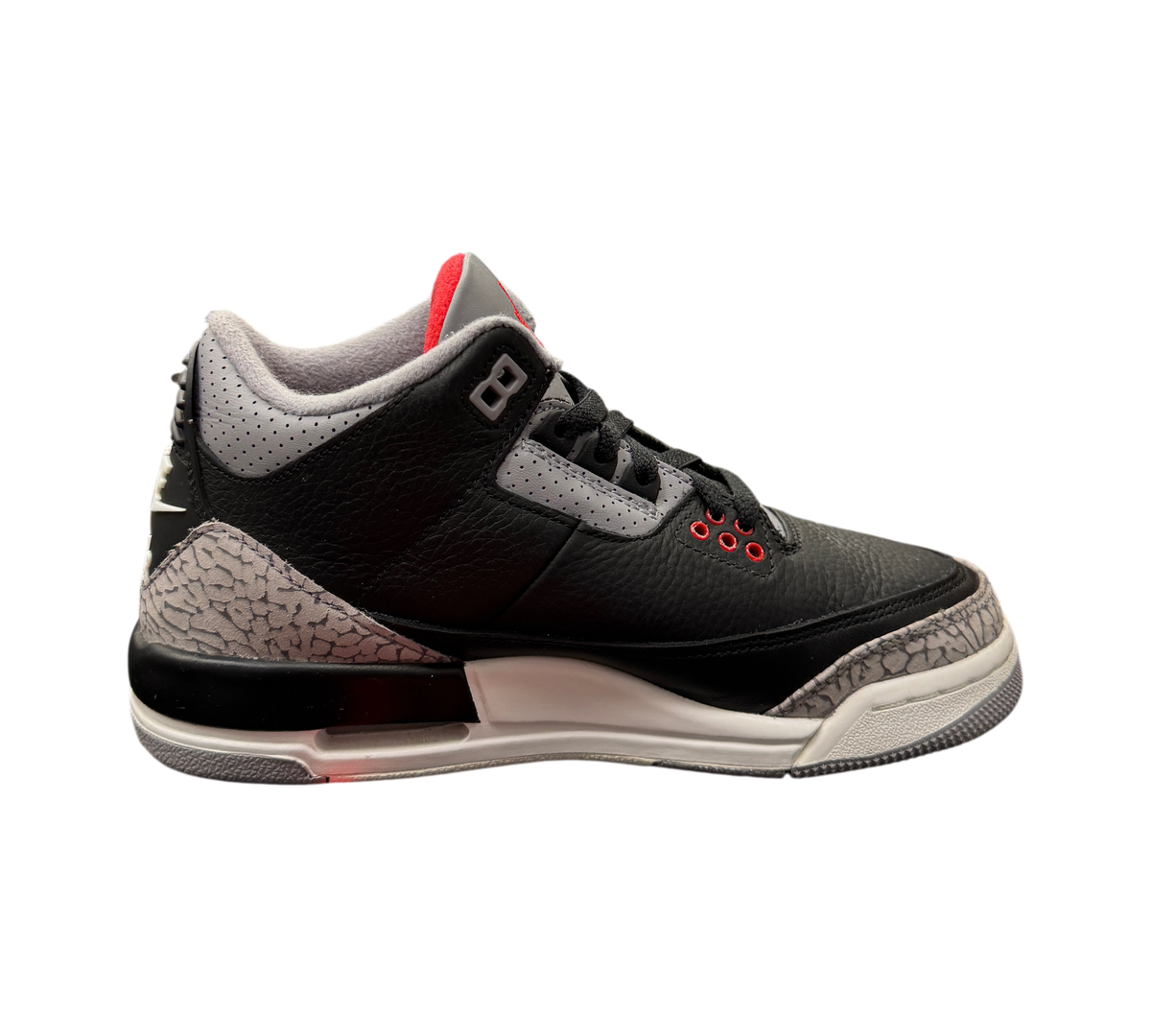 Genesis Boutique Jordan 3 GS Black Cement Reimagined sneakers featuring black leather and iconic elephant print trim