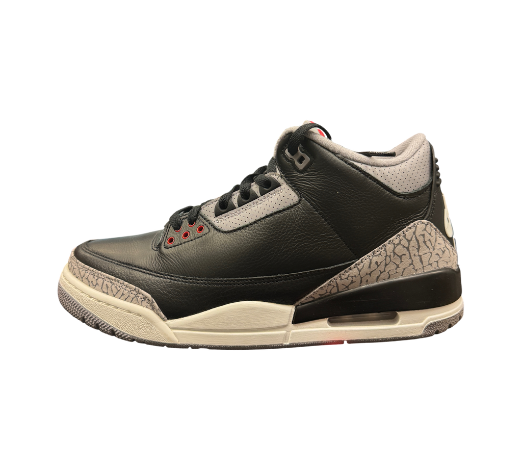 Genesis Boutique Jordan 3 Black Cement sneakers featuring black leather, grey elephant print, and red eyelet details.