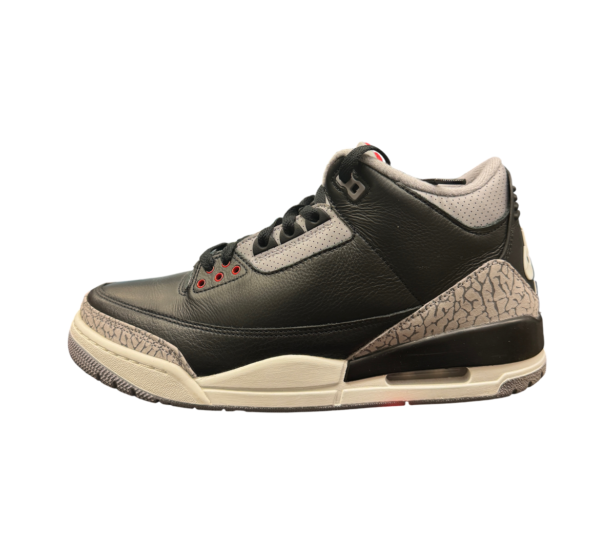 Genesis Boutique Jordan 3 Black Cement sneakers featuring black leather, grey elephant print, and red eyelet details.