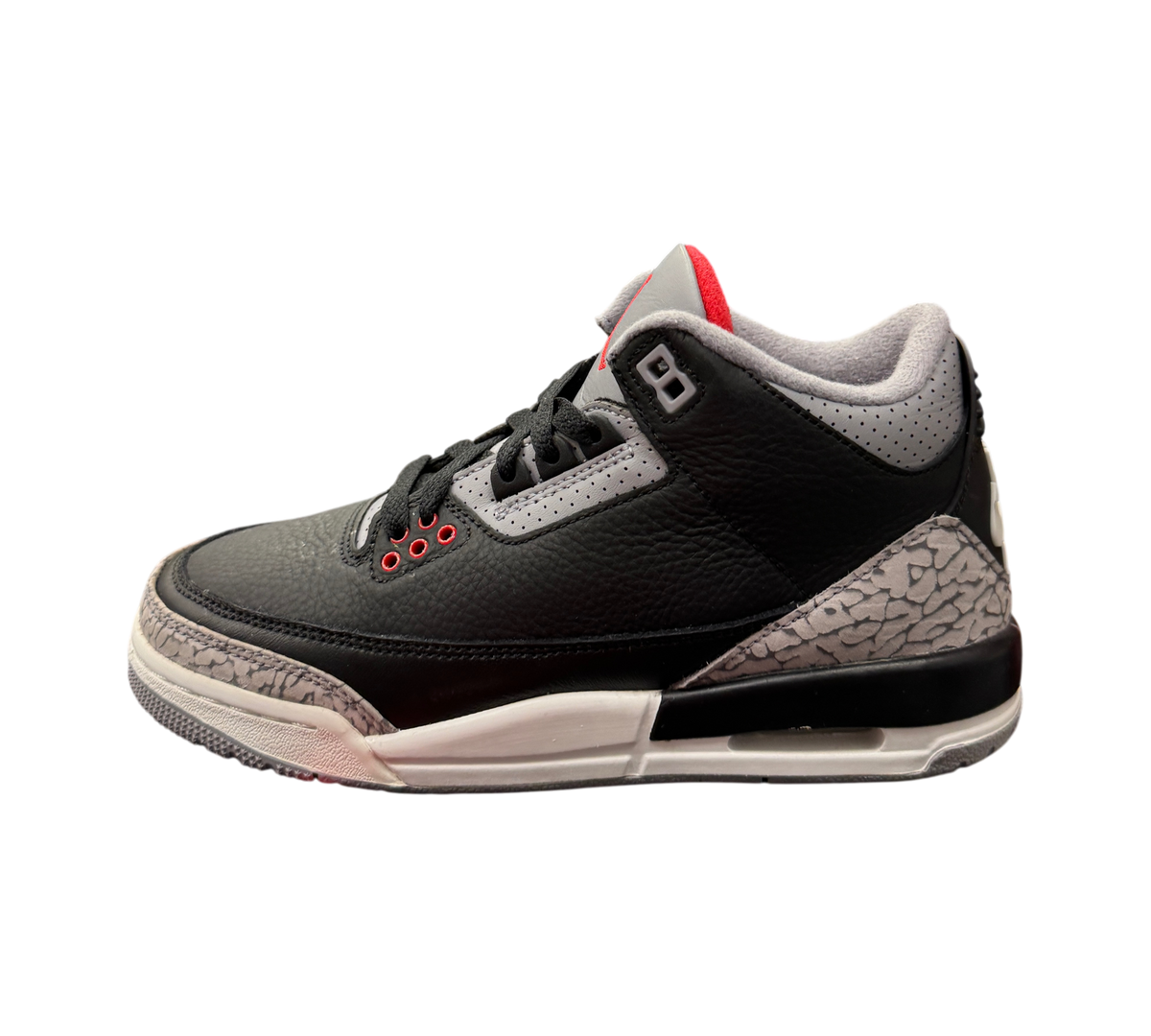Genesis Boutique Jordan 3 GS Black Cement Reimagined sneakers featuring black leather and iconic grey elephant print.
