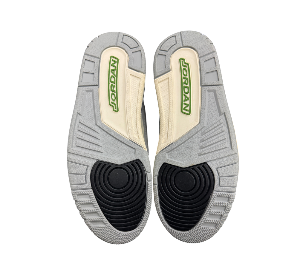 Genesis Boutique used Jordan 3 Chlorophyll sneakers showing the grey, black, and green rubber outsoles.