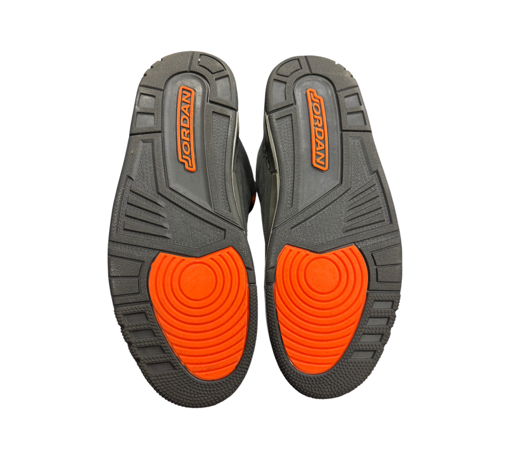 Genesis Boutique used Jordan 3 Fear sneakers showing the dark grey and bright orange rubber outsoles with Jordan branding