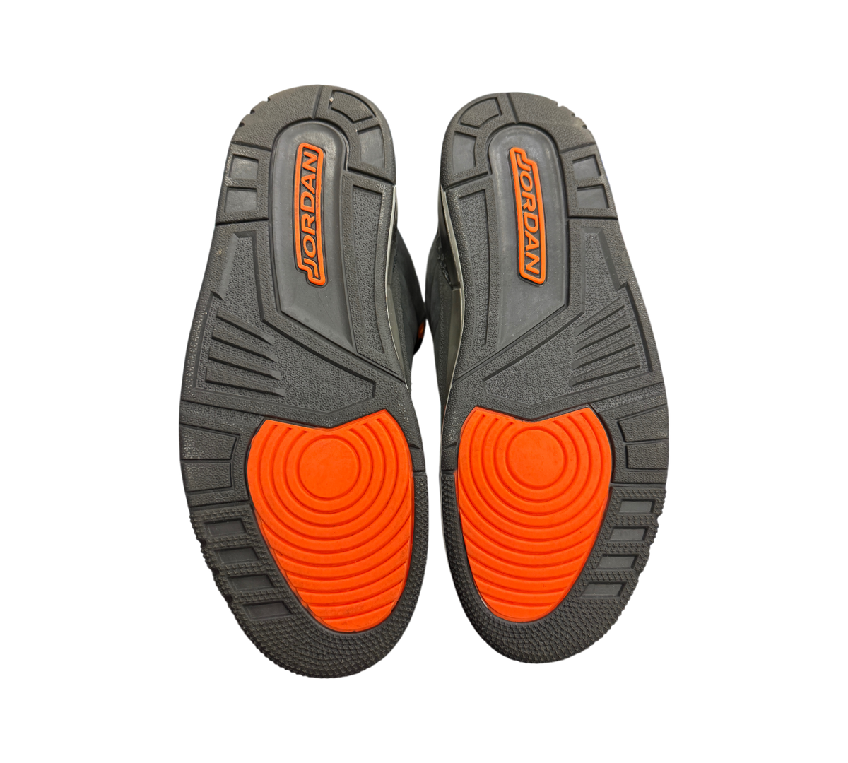 Genesis Boutique used Jordan 3 Fear sneakers showing the dark grey and bright orange rubber outsoles with Jordan branding