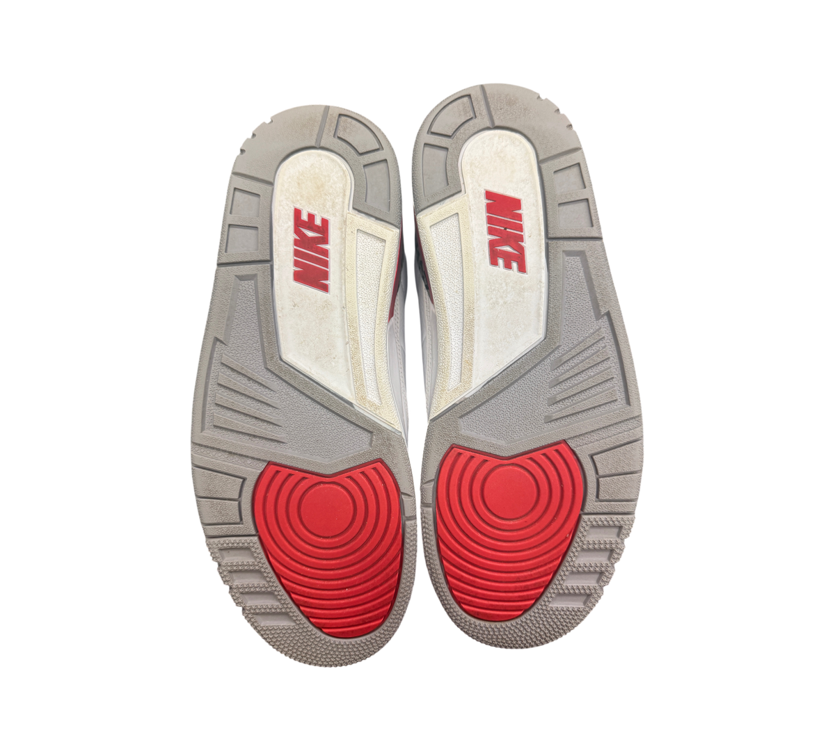 Genesis Boutique used Jordan 3 Fire Red sneakers showing the grey, white, and red rubber outsoles with Nike branding.