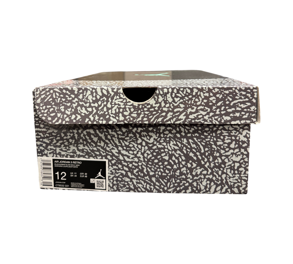 Genesis Boutique Jordan 3 Green Glow sneaker box with iconic grey and black elephant print pattern