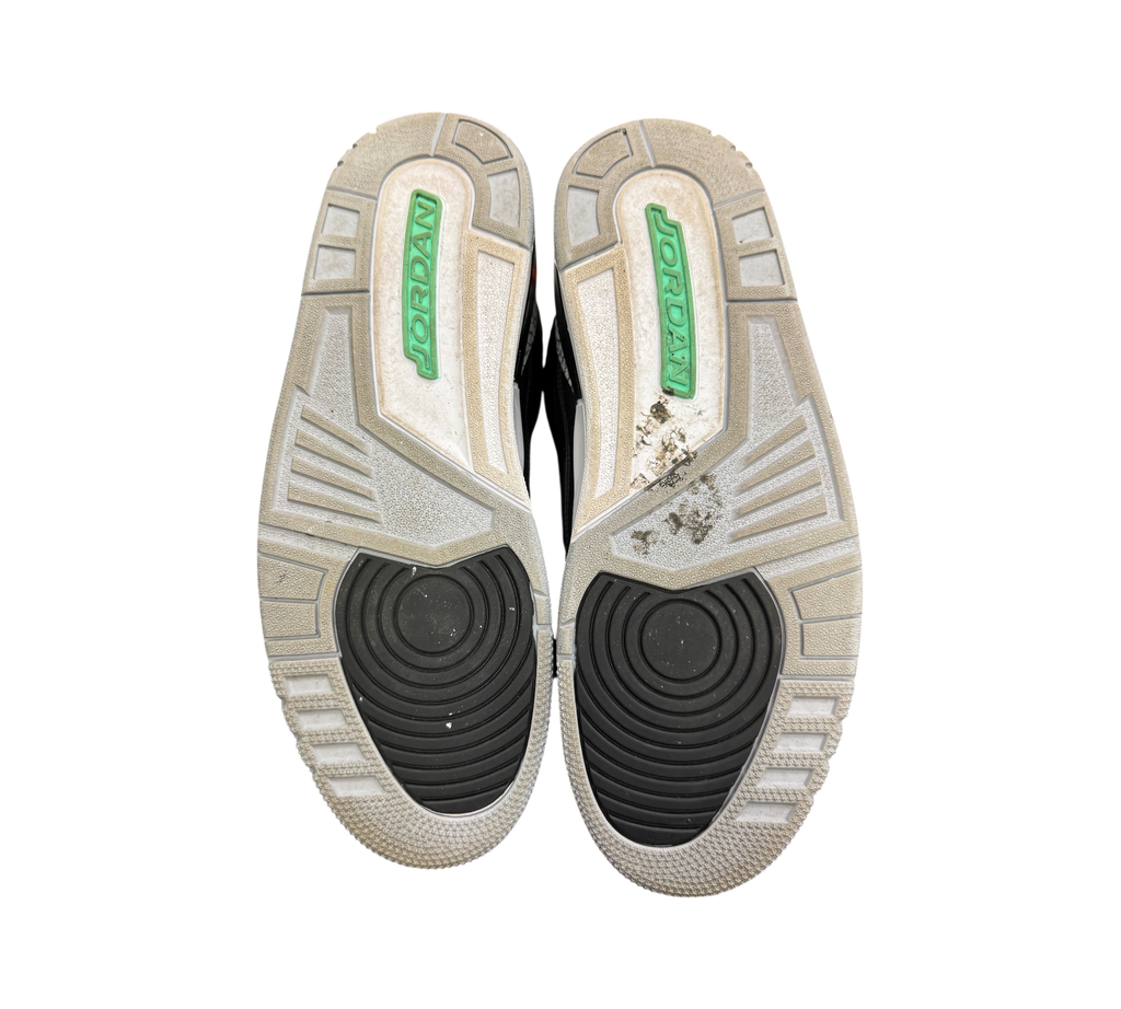 Genesis Boutique used Jordan 3 Green Glow sneakers showing grey and black rubber outsoles with green branding