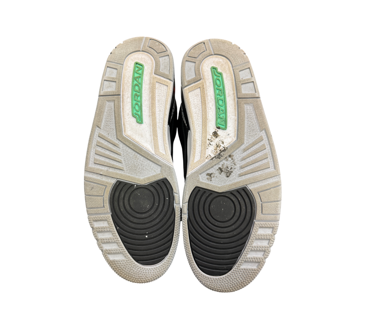 Genesis Boutique used Jordan 3 Green Glow sneakers showing grey and black rubber outsoles with green branding