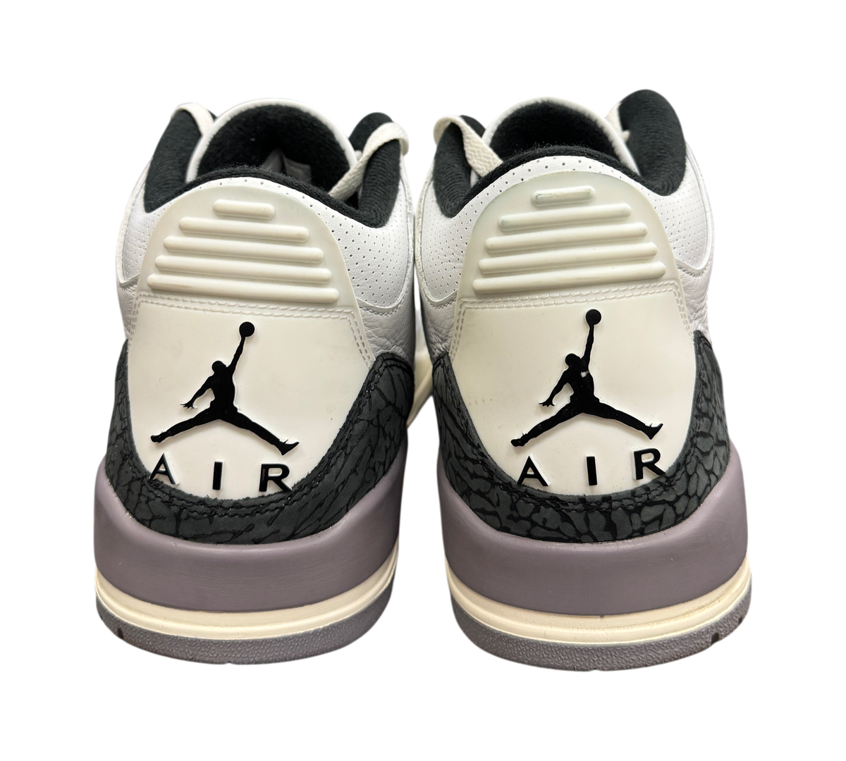 Genesis Boutique Jordan 3 Grey Cement sneakers showing back heel tabs with black Jumpman Air logos and elephant print