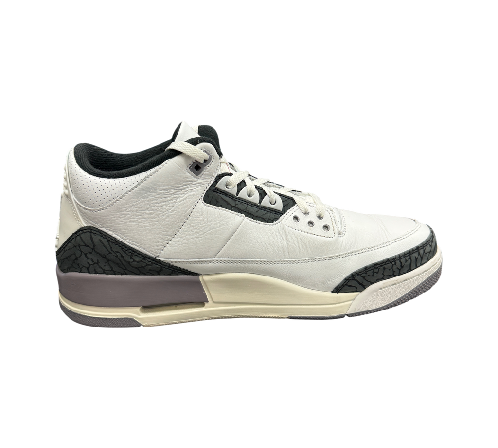 Genesis Boutique Jordan 3 Grey Cement sneakers in white leather with iconic elephant print overlays and grey accents.