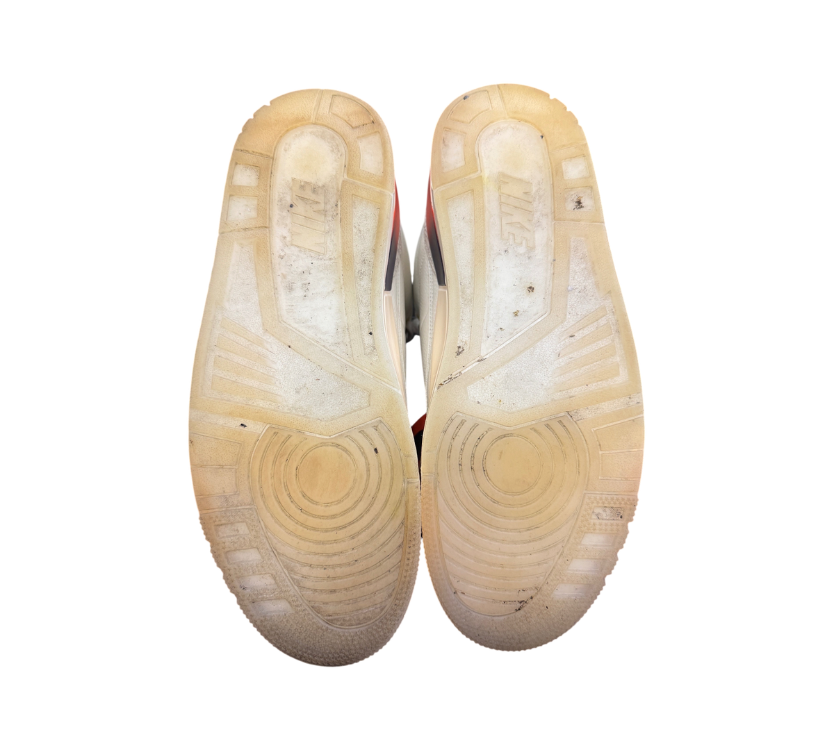 Genesis Boutique Jordan 3 J-Balvin Medellin Sunset sneakers showing the translucent rubber outsoles from below