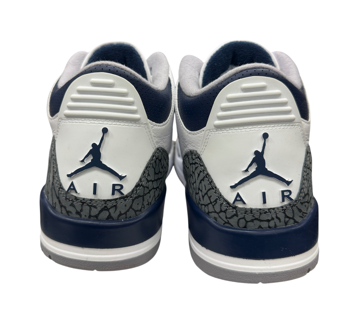 Genesis Boutique Jordan 3 Midnight Navy sneakers showing the white leather heels with navy accents and elephant print