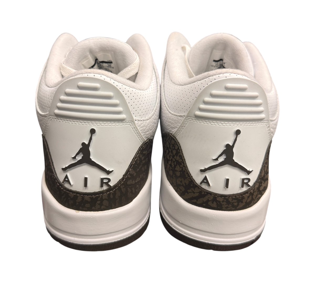 Genesis Boutique Jordan 3 "Mocha" sneakers with white leather and brown elephant print accents. Features Jumpman logo.
