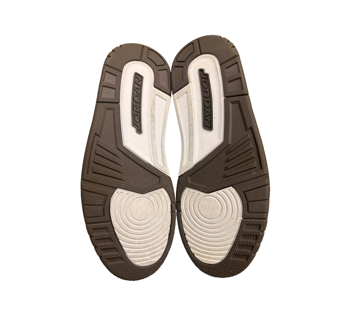 Genesis Boutique Jordan 3 "Mocha" sneakers, brown and white soles with Jordan branding.