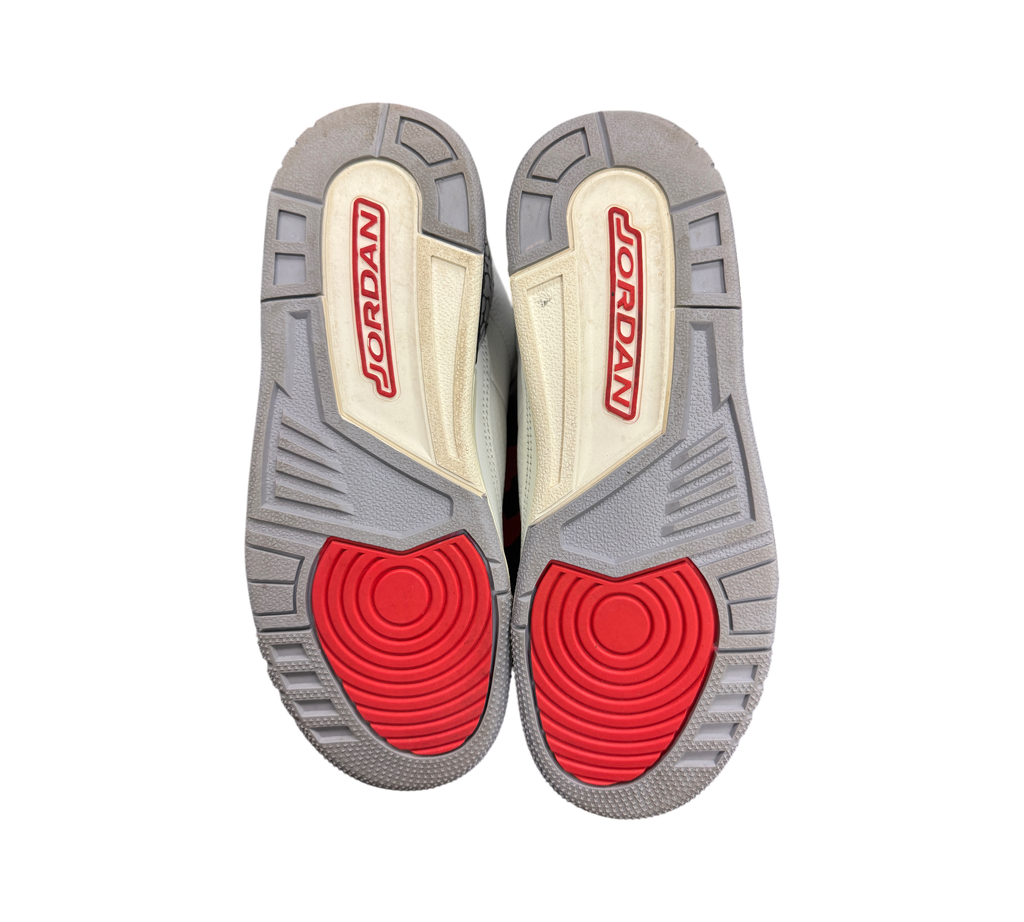 Genesis Boutique used Jordan 3 GS White Cement sneakers showing grey and red rubber outsoles with Jordan branding