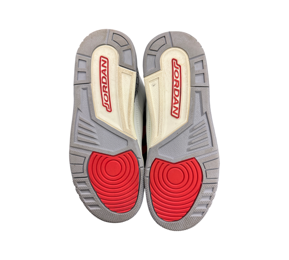 Genesis Boutique used Jordan 3 GS White Cement sneakers showing grey and red rubber outsoles with Jordan branding